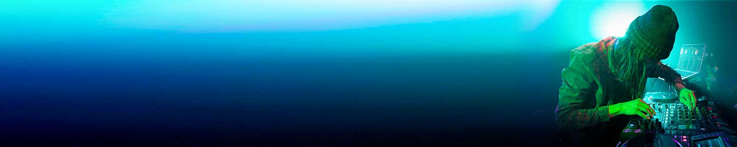 DJ in a hat turning nobs on his equipment