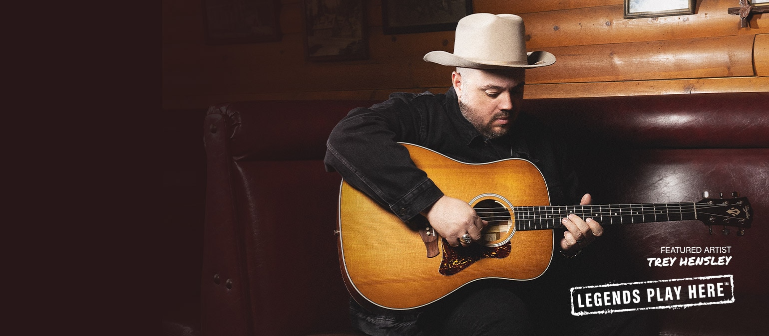 Trey Hensley playing a Taylor acoustic guitar.